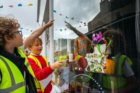 Falmouth schools judge Halloween window displays